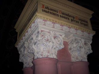 Faust's Study. Inscription above the column capitals reads, 